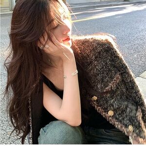 About Poem Classic golden black tweeted jacket